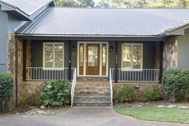 doorway to property featuring covered porch