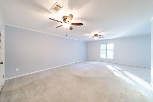 unfurnished room featuring light colored carpet, ceiling fan, and crown molding