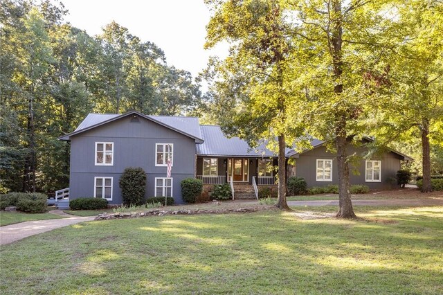 view of front facade with a front lawn and a porch