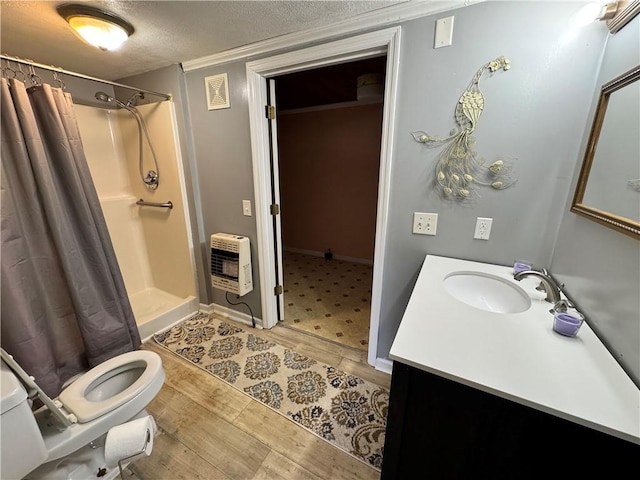 4380 County Road 62, Lafayette, AL 36862 - bathroom featuring heating unit, toilet, a shower with curtain, wood finished floors, and visible vents