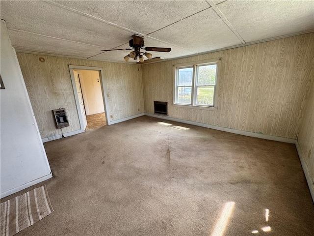 4380 County Road 62, Lafayette, AL 36862 - unfurnished living room with baseboards, heating unit, carpet, and a ceiling fan