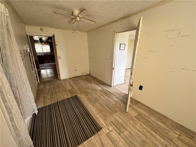 4380 County Road 62, Lafayette, AL 36862 - empty room with a textured ceiling, light wood-style floors, and ceiling fan