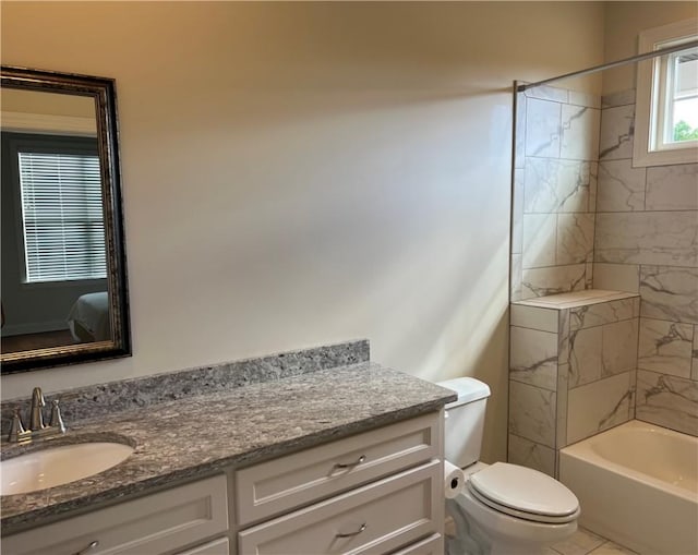 full bath featuring shower / bathing tub combination, vanity, and toilet