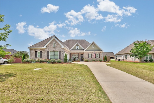 914 E Towne Lake Cir, Opelika, AL 36804 - craftsman-style home featuring driveway, a front yard, and brick siding