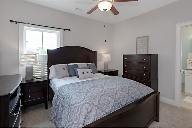 914 E Towne Lake Cir, Opelika, AL 36804 - bedroom featuring light colored carpet, connected bathroom, baseboards, and a ceiling fan