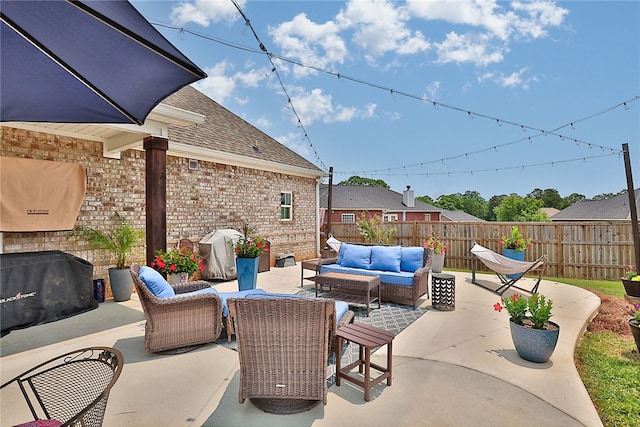 914 E Towne Lake Cir, Opelika, AL 36804 - fenced backyard with an outdoor living space, a patio area, and area for grilling