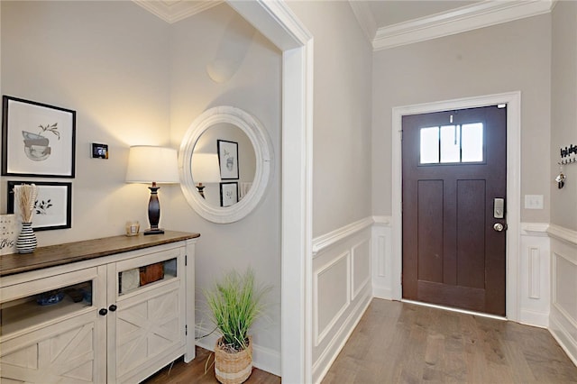 914 E Towne Lake Cir, Opelika, AL 36804 - foyer entrance featuring wood finished floors, a decorative wall, wainscoting, and crown molding