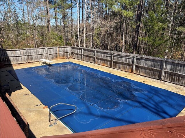 1016 County Road 515, Lanett, AL 36863 - view of swimming pool with a fenced backyard and a diving board