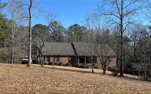 1016 County Road 515, Lanett, AL 36863 - view of front facade featuring brick siding