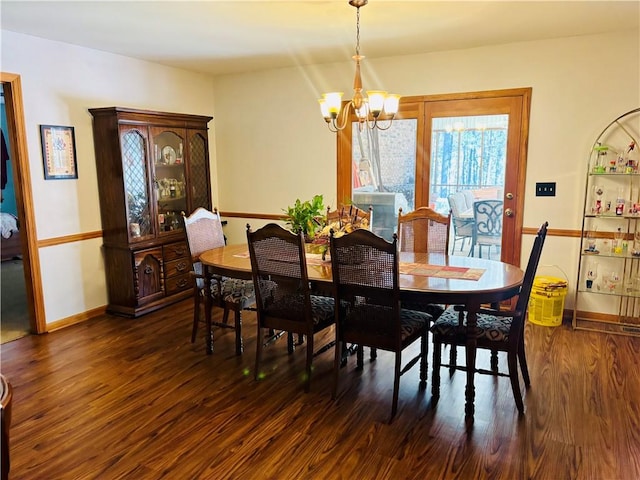 1016 County Road 515, Lanett, AL 36863 - dining area with a chandelier, dark wood finished floors, and baseboards