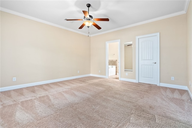 carpeted empty room featuring a ceiling fan, baseboards, and ornamental molding