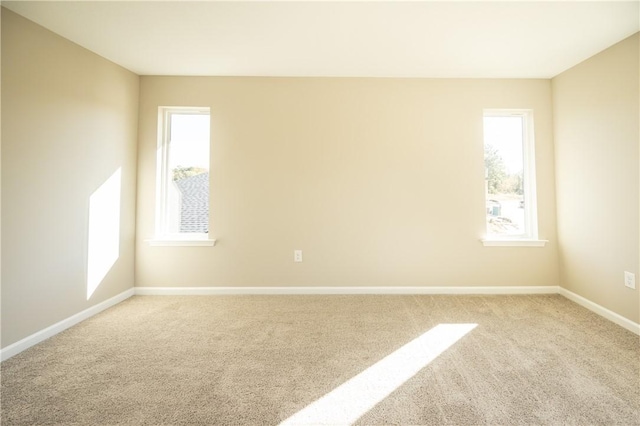 spare room with light carpet