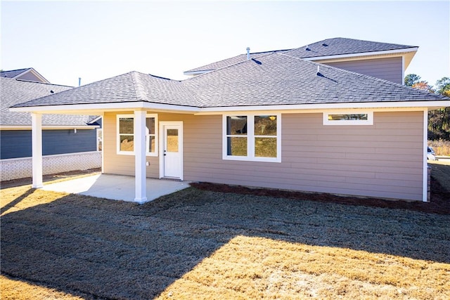 back of house featuring a yard and a patio area