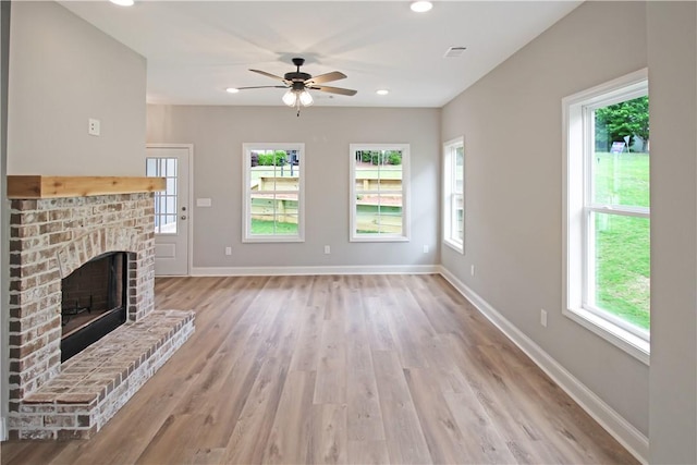 373 Lightness Dr, Auburn, AL 36832 - unfurnished living room featuring light wood-type flooring, a fireplace, a ceiling fan, baseboards, and recessed lighting