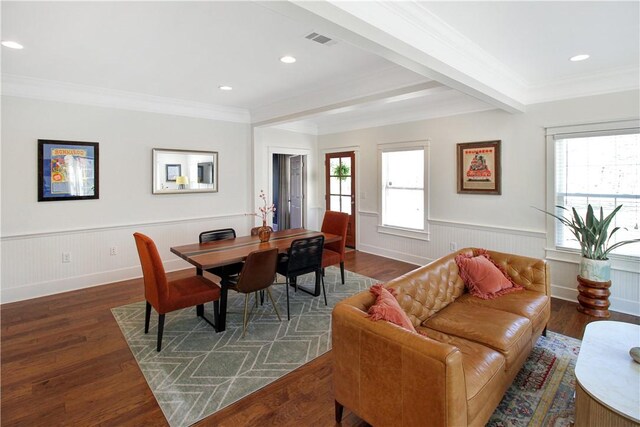 dining space with visible vents, a healthy amount of sunlight, and wainscoting