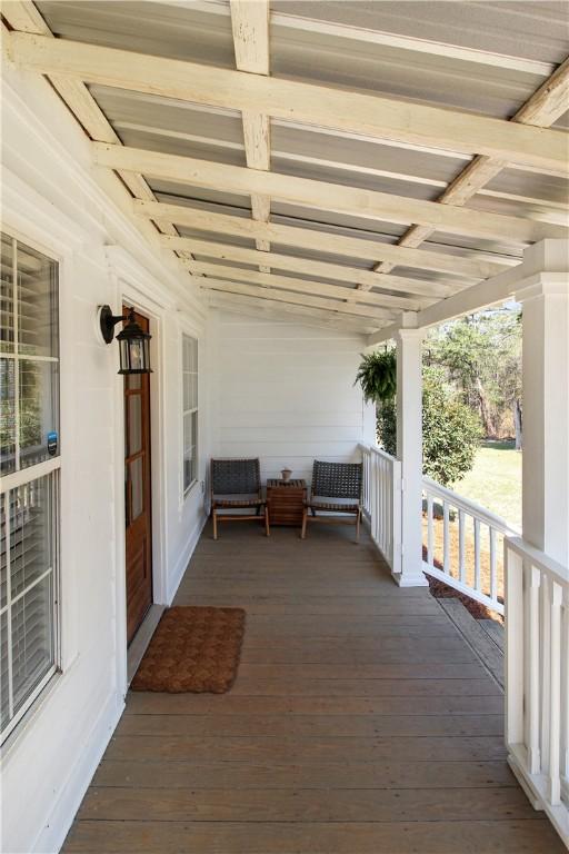 wooden terrace featuring a porch