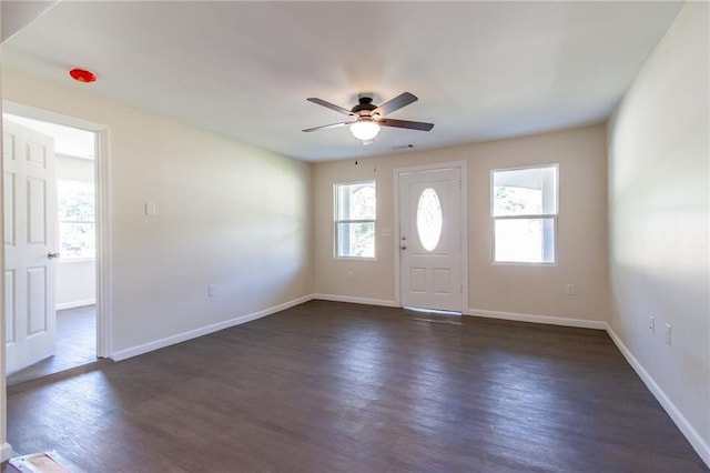entryway featuring dark wood-type flooring, baseboards, and a ceiling fan