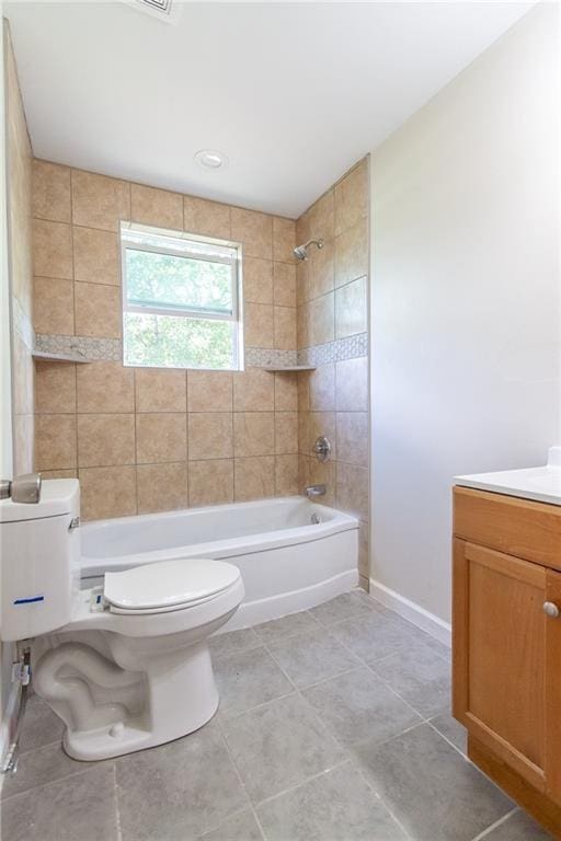 bathroom featuring vanity, tile patterned flooring,  shower combination, toilet, and baseboards