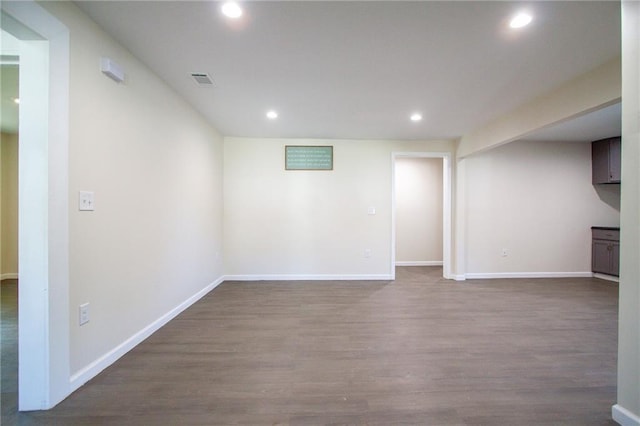 finished below grade area with wood finished floors, baseboards, and recessed lighting