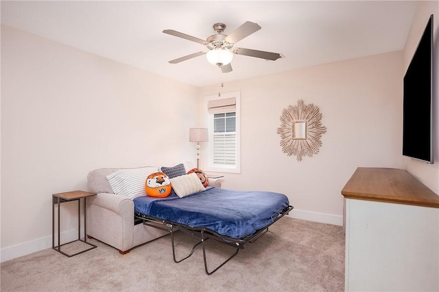bedroom featuring baseboards, a ceiling fan, and carpet flooring