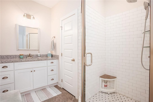 full bath featuring a shower stall, tile patterned floors, and vanity