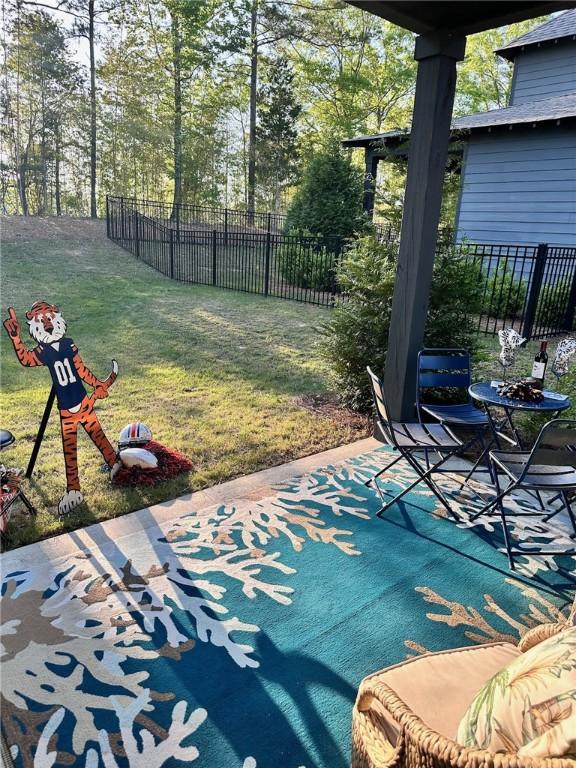 view of patio featuring fence
