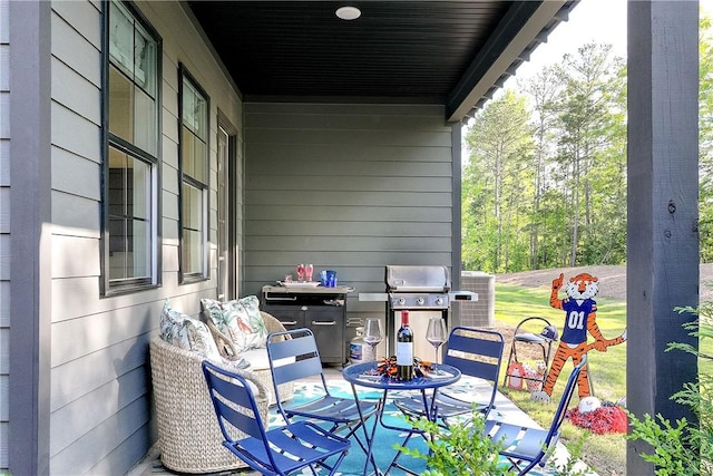 view of patio with grilling area and central air condition unit