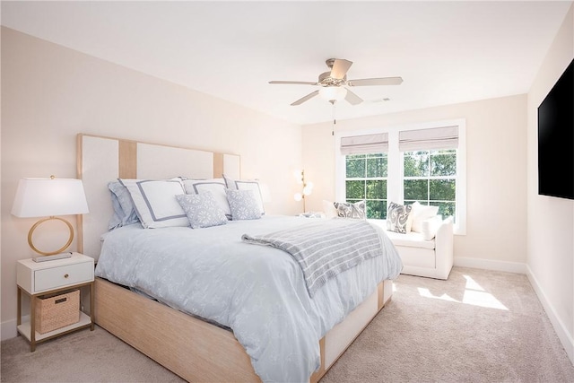 bedroom featuring ceiling fan, baseboards, and carpet flooring