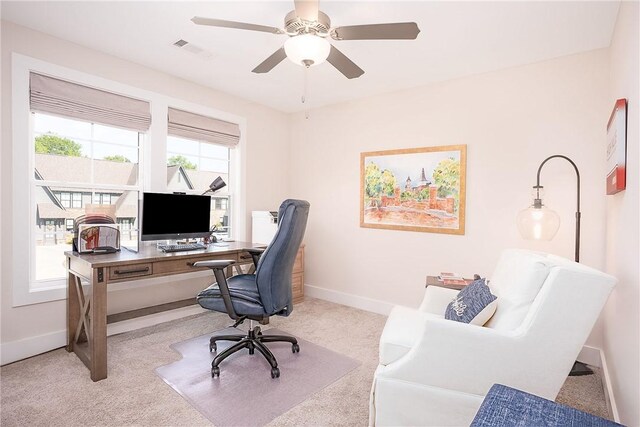 sitting room featuring baseboards, carpet floors, and ceiling fan