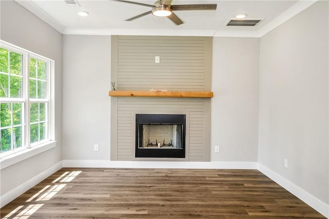325 Whisper Trce, Tallassee, AL 36078 - unfurnished living room with a fireplace, crown molding, ceiling fan, baseboards, and wood finished floors