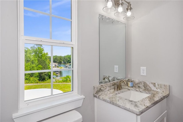 325 Whisper Trce, Tallassee, AL 36078 - bathroom with a chandelier, vanity, healthy amount of natural light, and toilet