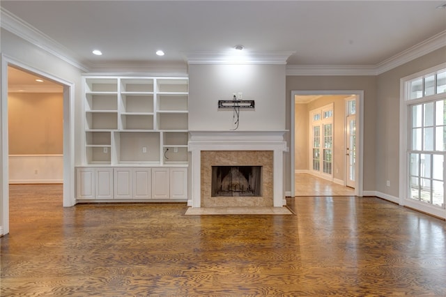 1761 Woodley Rd, Auburn, AL 36830 - unfurnished living room featuring ornamental molding, wood finished floors, a tile fireplace, and recessed lighting