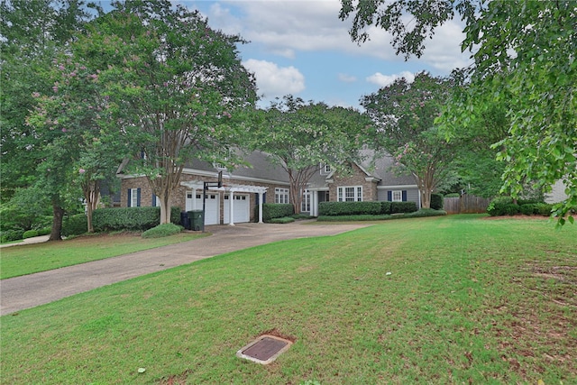 1761 Woodley Rd, Auburn, AL 36830 - view of front of property with a garage, asphalt driveway, and brick siding