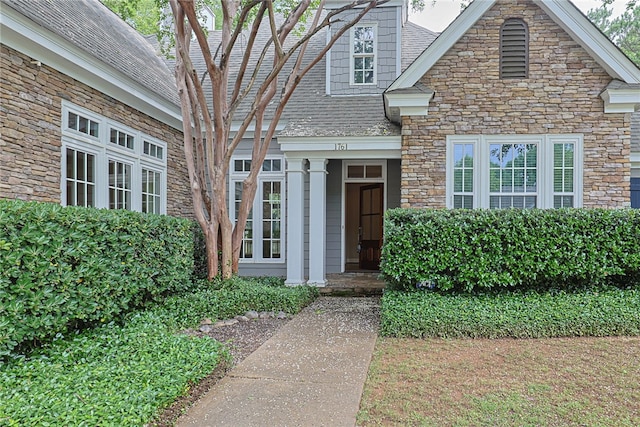 1761 Woodley Rd, Auburn, AL 36830 - view of exterior entry featuring stone siding and roof with shingles