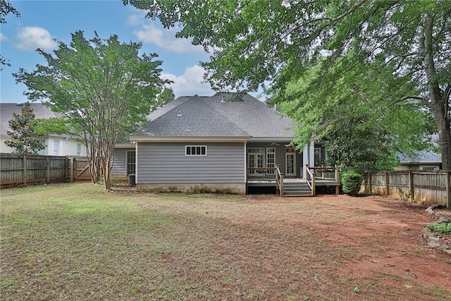 1761 Woodley Rd, Auburn, AL 36830 - rear view of house with a fenced backyard, a wooden deck, and roof with shingles