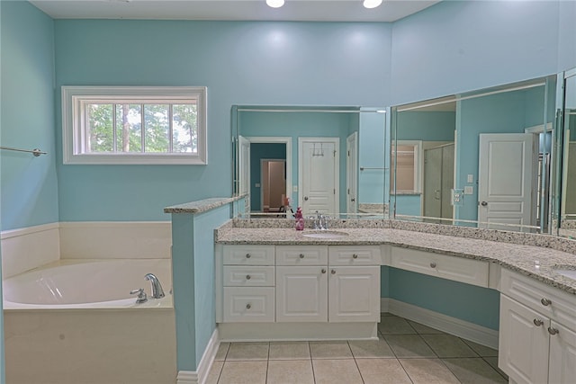 1761 Woodley Rd, Auburn, AL 36830 - full bath featuring tile patterned floors, double vanity, a bath, and a shower stall