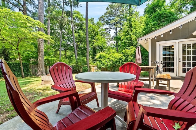 333 Tullahoma Dr, Auburn, AL 36830 - view of patio / terrace featuring french doors, outdoor dining area, and view of wooded area