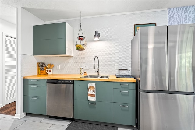 333 Tullahoma Dr, Auburn, AL 36830 - kitchen featuring appliances with stainless steel finishes, a sink, wood counters, and green cabinets