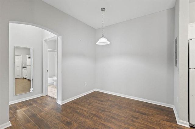 unfurnished dining area with dark hardwood / wood-style flooring