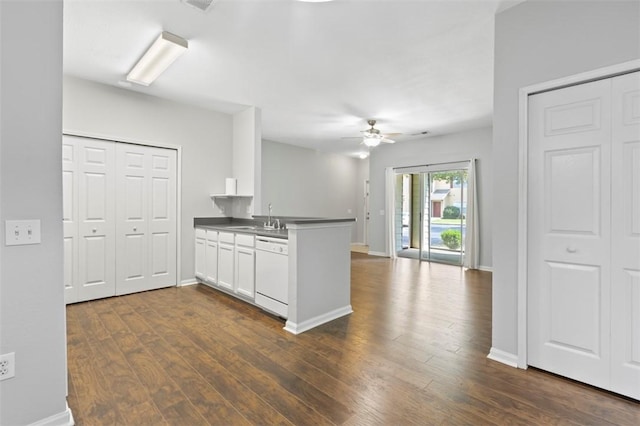 kitchen with sink, dishwasher, ceiling fan, white cabinets, and kitchen peninsula