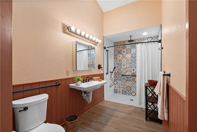 1115 Willow Run, Opelika, AL 36801 - full bathroom with wainscoting, wood tiled floors, and tiled shower