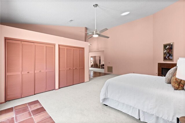 1115 Willow Run, Opelika, AL 36801 - carpeted bedroom with multiple closets, a ceiling fan, and high vaulted ceiling