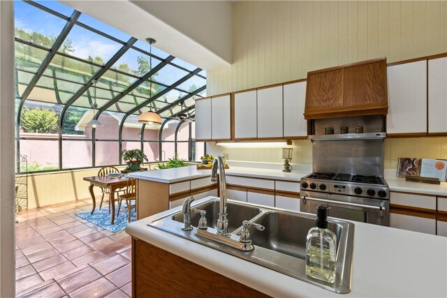 1115 Willow Run, Opelika, AL 36801 - kitchen featuring stainless steel range, light countertops, decorative backsplash, and white cabinetry