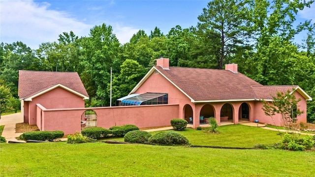 1115 Willow Run, Opelika, AL 36801 - view of front of property featuring a chimney, stucco siding, and a gate