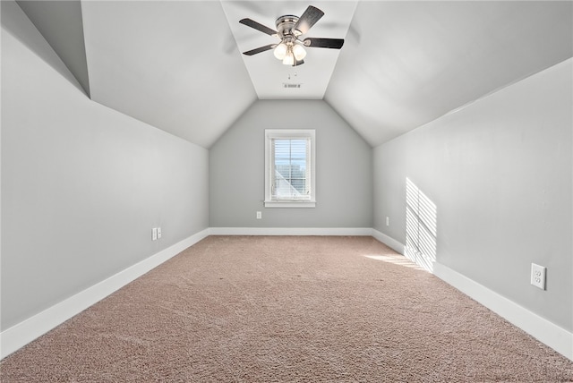 additional living space featuring vaulted ceiling, ceiling fan, and carpet