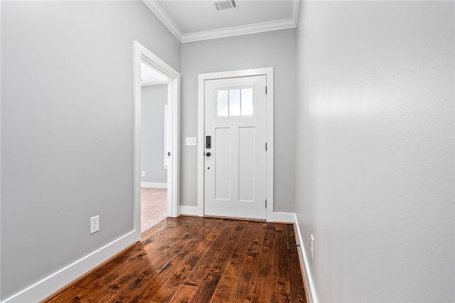 foyer with ornamental molding and dark hardwood / wood-style flooring