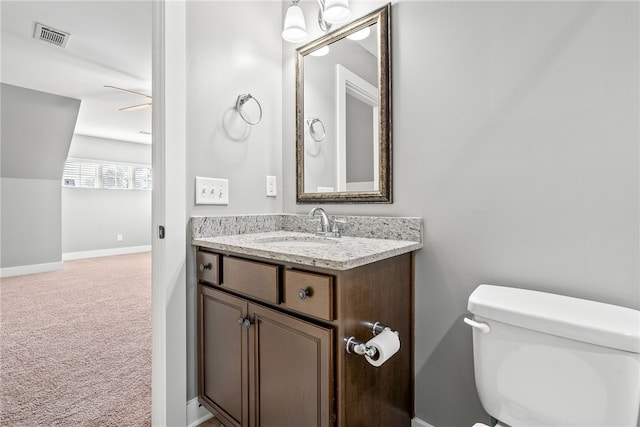 bathroom with vanity and toilet