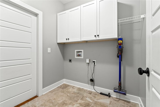 laundry area with hookup for a washing machine, cabinets, and hookup for an electric dryer