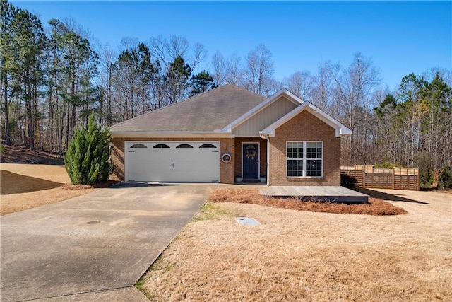 single story home with brick siding, an attached garage, driveway, and fence