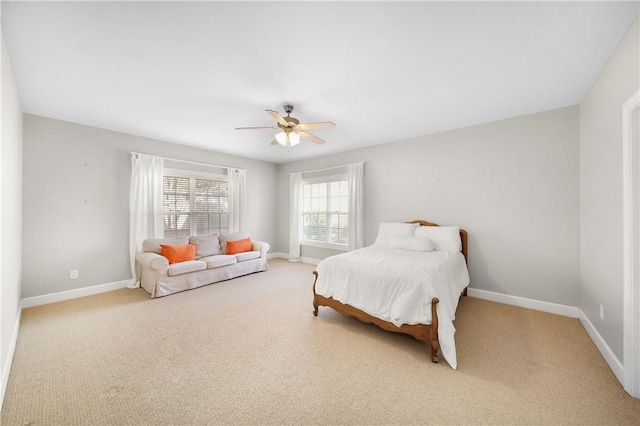 bedroom featuring ceiling fan and light colored carpet